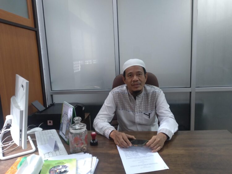 Kepala UPT Pembelajaran di Luar Kampus (UPT Pelpus), Syofyan saat ditemui di UPT Pelpus Gedung PKM lt.1 Universitas Andalas pada Jumat (19/8/2022). (Genta Andalas/Souty Syahrani)